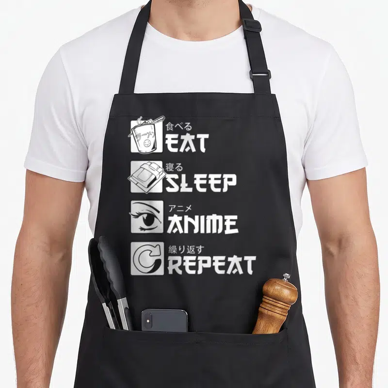 Eat anime apron - EAT SLEEP ANIME REPEAT text with ramen, futon, eye, and repeat icons in white squares — shown on a black cotton canvas apron against a white background