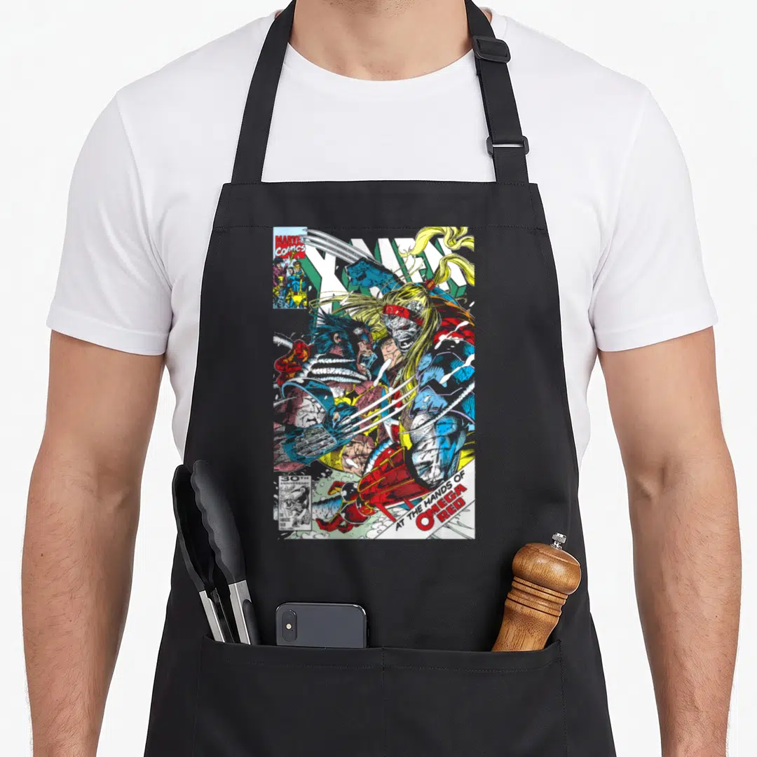 Comic book apron - Omega Red fighting scene with Marvel Comics logo and bottom right text at the hands of Omega Red — shown on a black cotton canvas apron against a white background