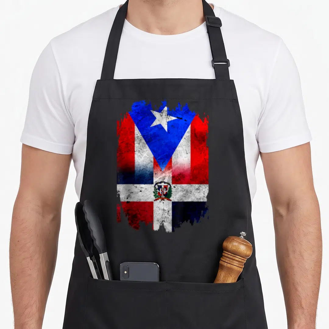 Dominirican dominican boy apron - Merged Puerto Rican and Dominican flags with distressed red white blue splatter effect — shown on a black cotton canvas apron against a white background