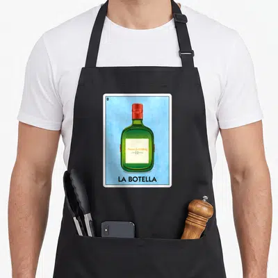 Scotch mexican apron - Playing card art with green bottle and La Botella text on blue background — shown on a black cotton canvas apron against a white background