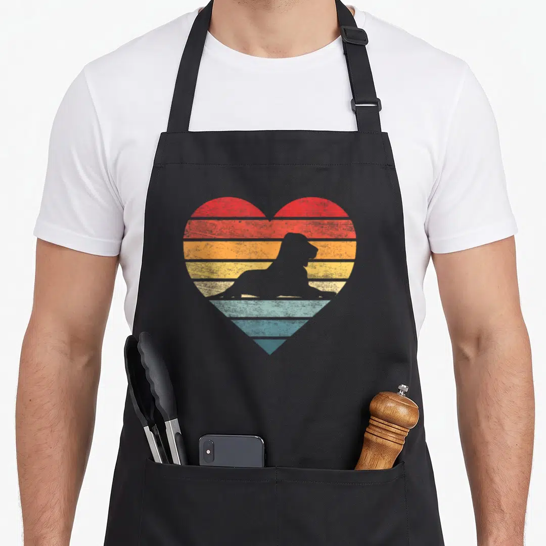 Owner sunset dog apron - Retro heart with red orange yellow blue stripes and grey dog silhouette — shown on a black cotton canvas apron against a white background