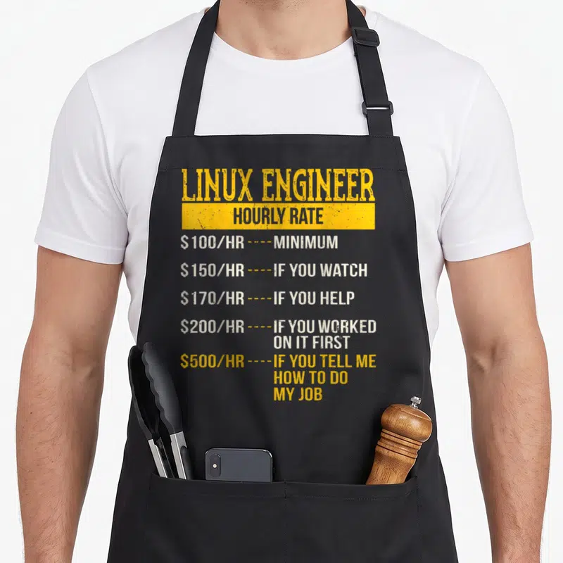 Rate engineer apron - Stacked typography listing Linux Engineer hourly rates from 100 to 500 dollars per hour — shown on a black cotton canvas apron against a white background
