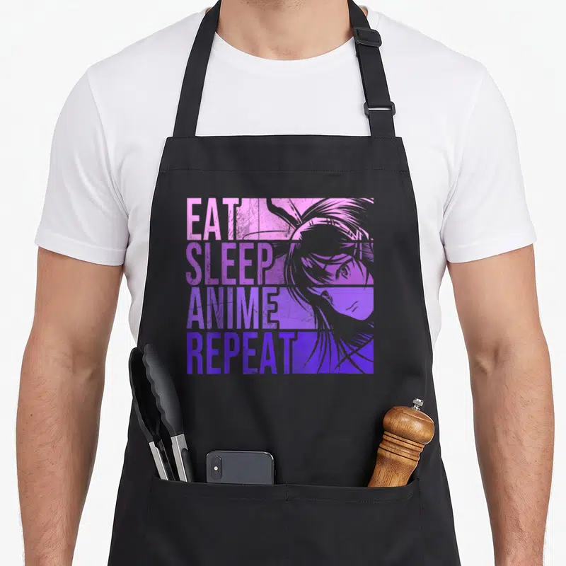 Repeat anime apron - EAT SLEEP ANIME REPEAT text stacked in pink purple blue over stylized anime head — shown on a black cotton canvas apron against a white background