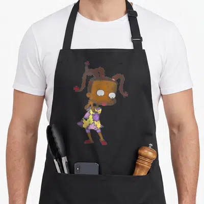Susie watercolor apron - Cartoon girl with brown pigtails, yellow dress with purple flowers, and red shoes standing — shown on a black cotton canvas apron against a white background