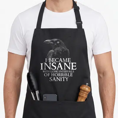 Allan edgar award apron - White raven head line art above stacked text I became insane with long intervals of horrible — shown on a black cotton canvas apron against a white background