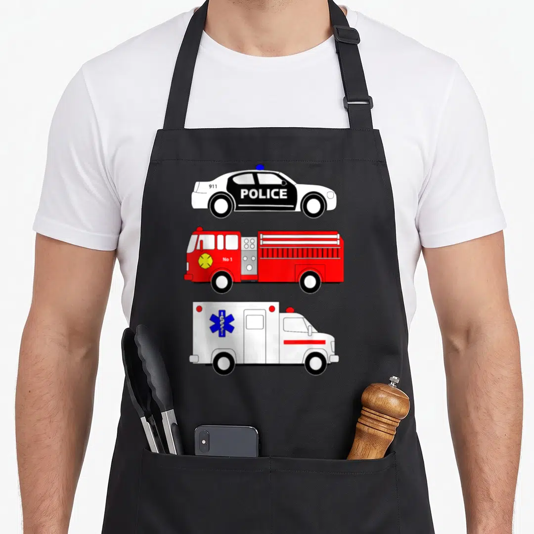 Police truck apron - Three stacked emergency vehicles: police car with 911 POLICE, red fire truck with No 1, white — shown on a black cotton canvas apron against a white background