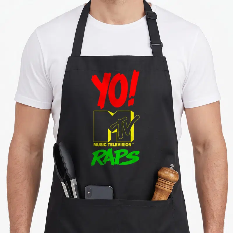 Mtv rap apron - Red yellow green stacked Yo MTV Raps logo typography — shown on a black cotton canvas apron against a white background