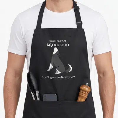 Part dog apron - Cartoon grey and white husky howling with text Which Part of Aroooo Don't You Understand — shown on a black cotton canvas apron against a white background