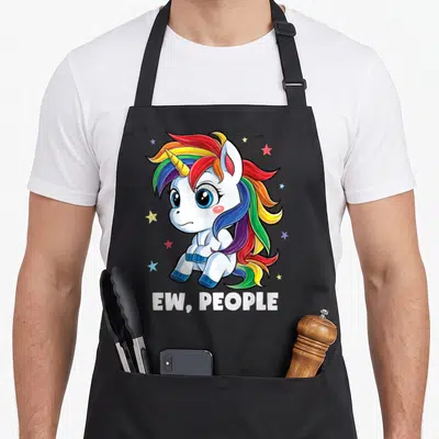 Funny unicorn rainbow apron - Cartoon unicorn with rainbow mane sitting above white text reading EW PEOPLE — shown on a black cotton canvas apron against a white background