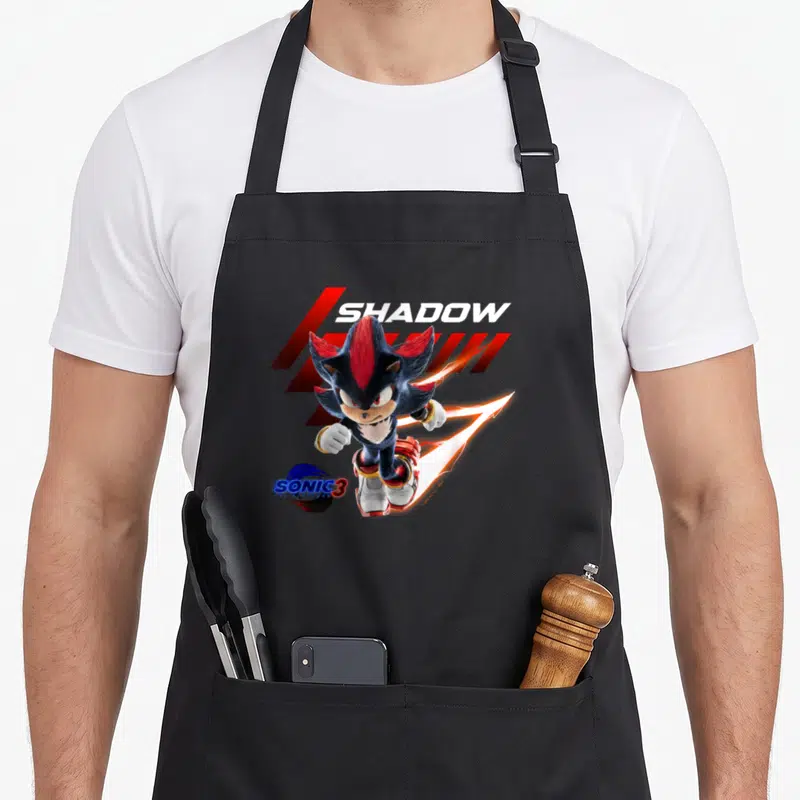 Charge crazy hedgehog man apron - Realistic Shadow the Hedgehog running with orange lightning and SONIC 3 logo on black — shown on a black cotton canvas apron against a white background