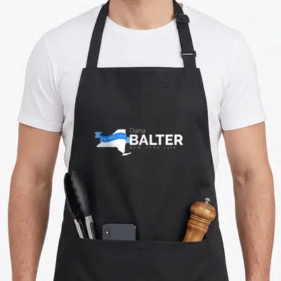 Dana new york apron - White NY state map with blue ribbon reading BLUE WAVE 2018 and Dana Balter 24th text — shown on a black cotton canvas apron against a white background