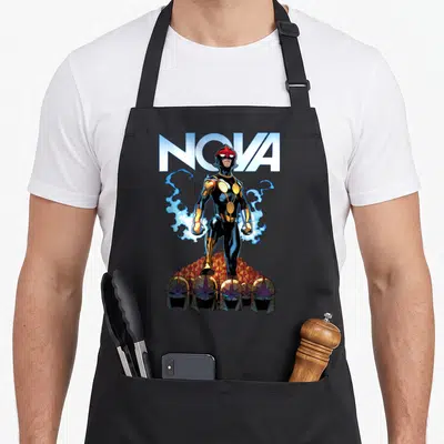 Comic cosmic apron - Nova character standing over helmets with blue energy and gold accents — shown on a black cotton canvas apron against a white background