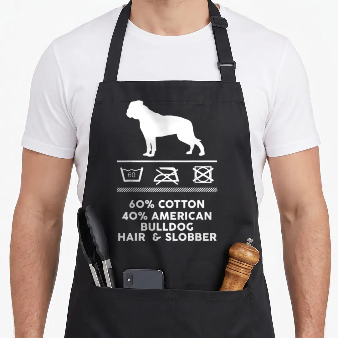 Funny american bulldog apron - White bulldog silhouette above laundry symbols and text 60% cotton 40% american bulldog — shown on a black cotton canvas apron against a white background