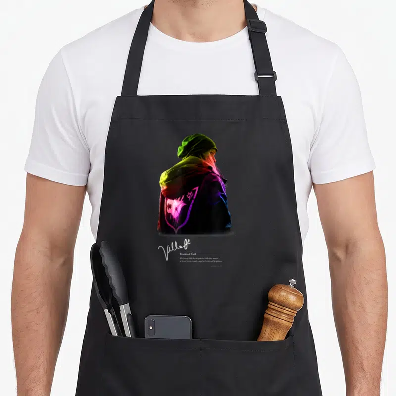 Village gaming apron - Person in hoodie with purple emblem and white text about Rose's journey to a twisted realm — shown on a black cotton canvas apron against a white background