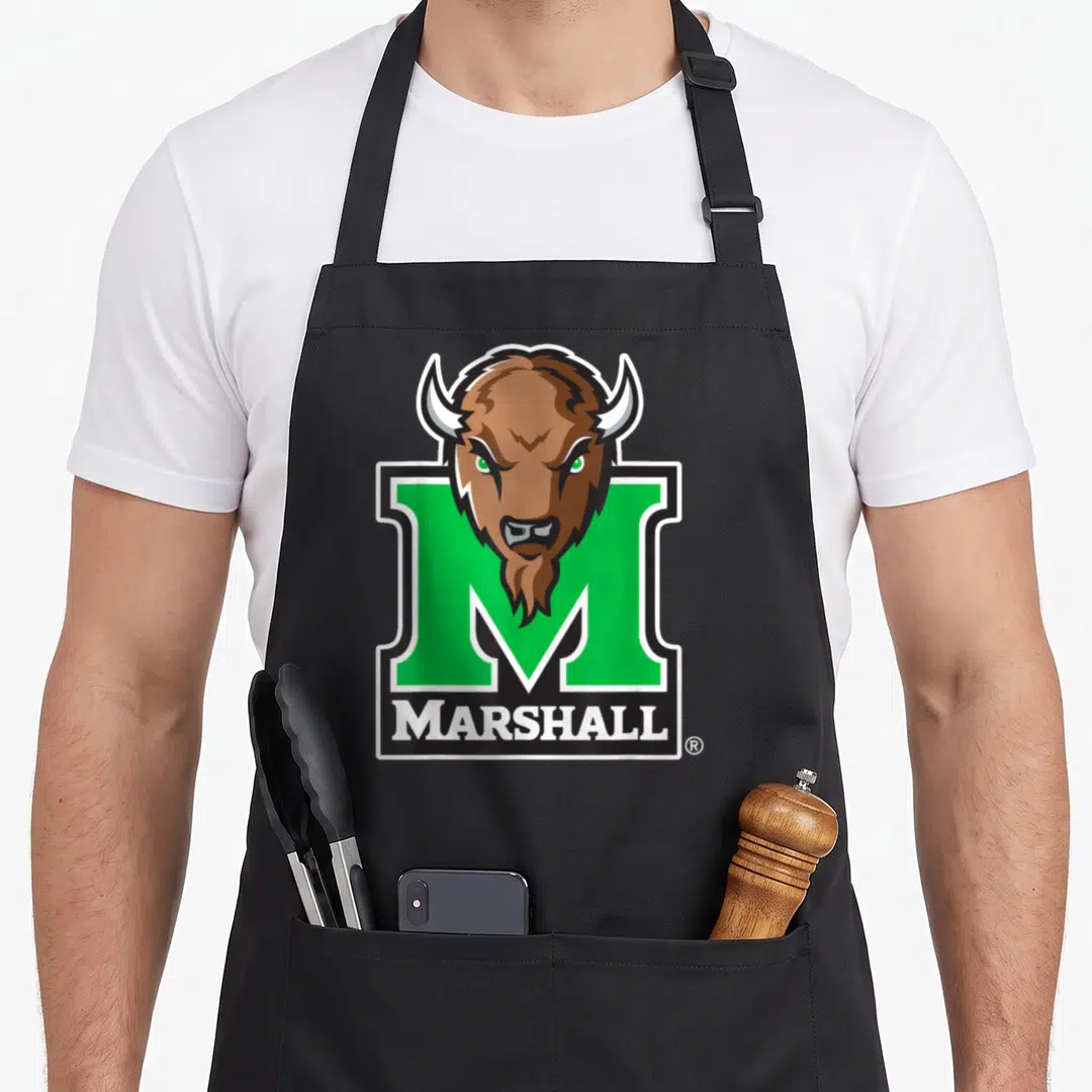 Icon marshalls apron - Cartoon brown bison head over green M with white MARSHALL text on black bar — shown on a black cotton canvas apron against a white background