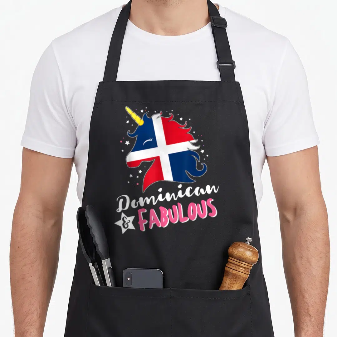 Dominican unicorn apron - Cartoon unicorn head with flag colors and stacked Dominican & FABULOUS text surrounded — shown on a black cotton canvas apron against a white background