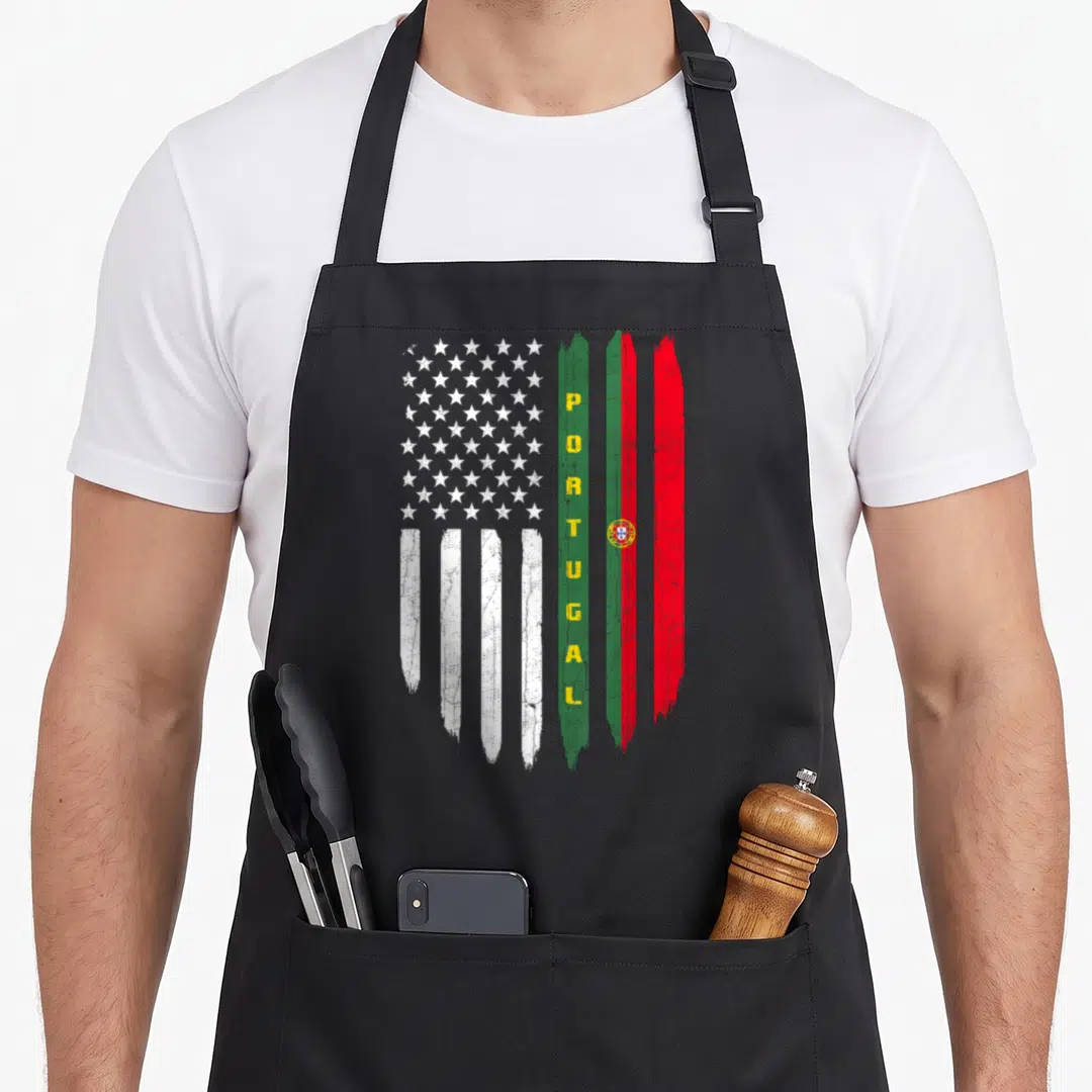Flag portugal portuguese apron - Distressed US and Portugal flags merged side-by-side with vertical yellow PORTUGAL — shown on a black cotton canvas apron against a white background