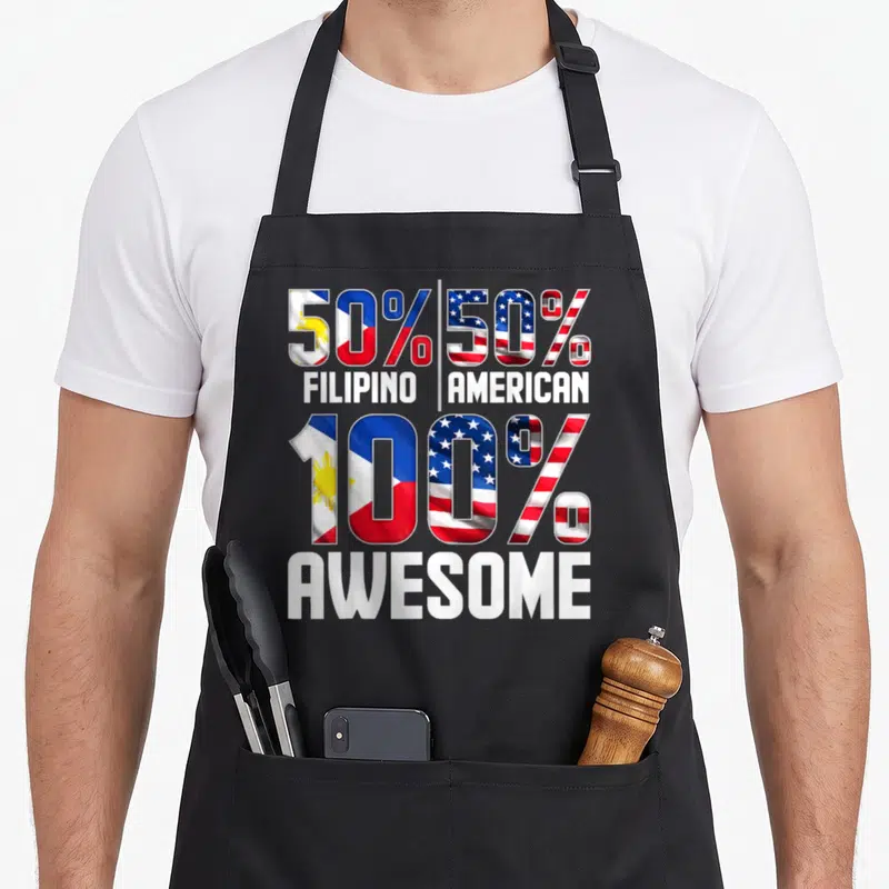 Funny filipino patriotic apron - 50% Filipino 50% American 100% Awesome flag typography design — shown on a black cotton canvas apron against a white background