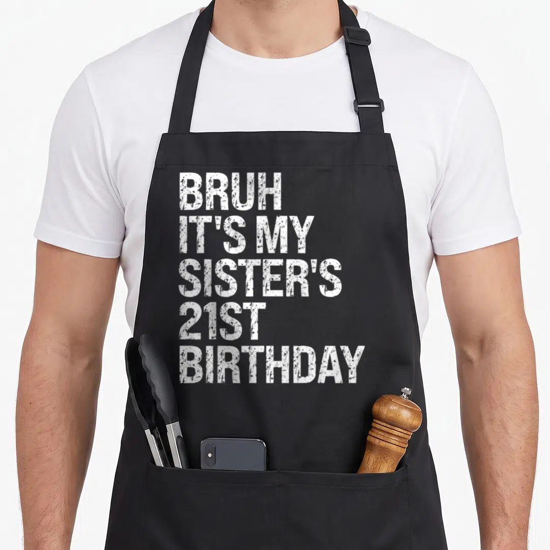 Sister queen of baking apron - White distressed text reading BRUH IT'S MY SISTER'S 21ST BIRTHDAY stacked vertically — shown on a black cotton canvas apron against a white background