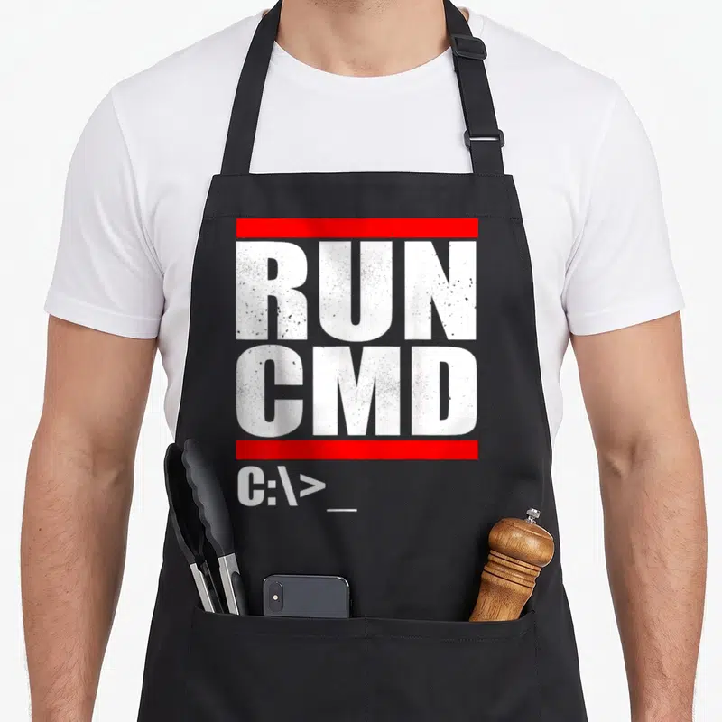 Run nerd apron - White RUN CMD text and C:\> prompt between two red horizontal bars — shown on a black cotton canvas apron against a white background