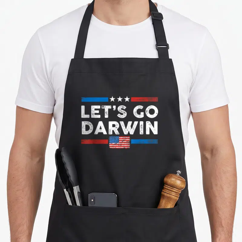 Darwin flag us aprons - Let's Go Darwin text with US flag and stars in distressed red white blue — shown on a black cotton canvas apron against a white background