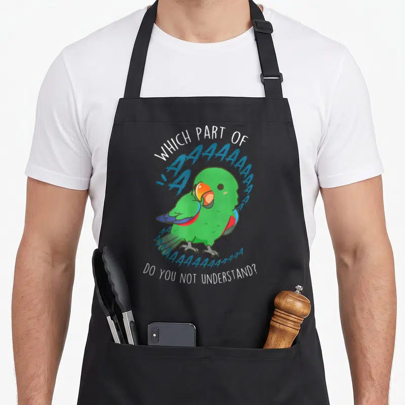 Eclectus bird apron - Cartoon green parrot with blue screaming letters and sarcastic quote — shown on a black cotton canvas apron against a white background