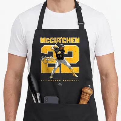 Ballpark modern apron - McCutchen 22 Pittsburgh Baseball player graphic with yellow number and signature — shown on a black cotton canvas apron against a white background