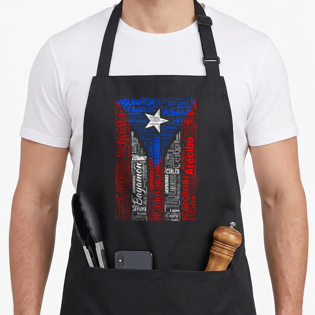 Rican puerto apron - Word cloud map of Puerto Rico cities in red blue and white typography — shown on a black cotton canvas apron against a white background