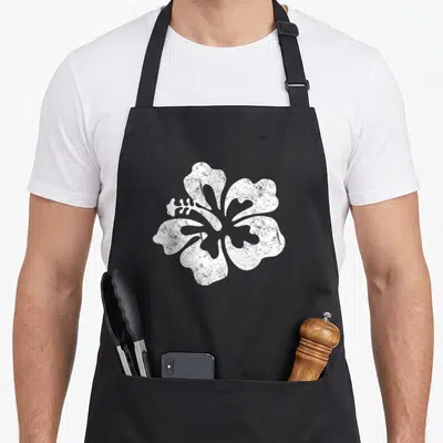 Hibiscus flower hawaiian apron - Single distressed white hibiscus flower centered on grey background — shown on a black cotton canvas apron against a white background