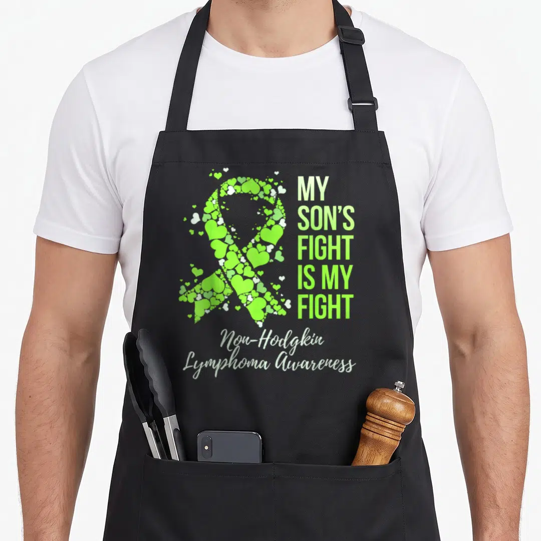 Fight lymphoma awareness apron - Lime green heart ribbon and My Son's Fight Is My Fight text for Non-Hodgkin Lymphoma — shown on a black cotton canvas apron against a white background
