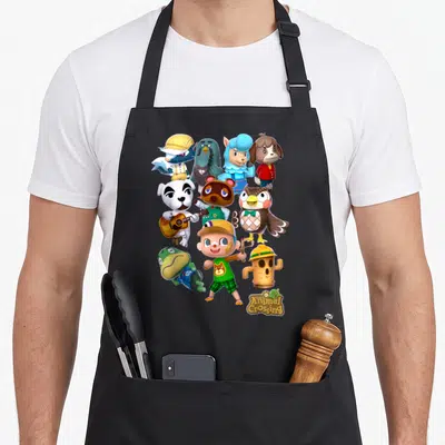 Leaf novelty apron - pyramid of cartoon animal villagers and human character with welcome logo — shown on a black cotton canvas apron against a white background