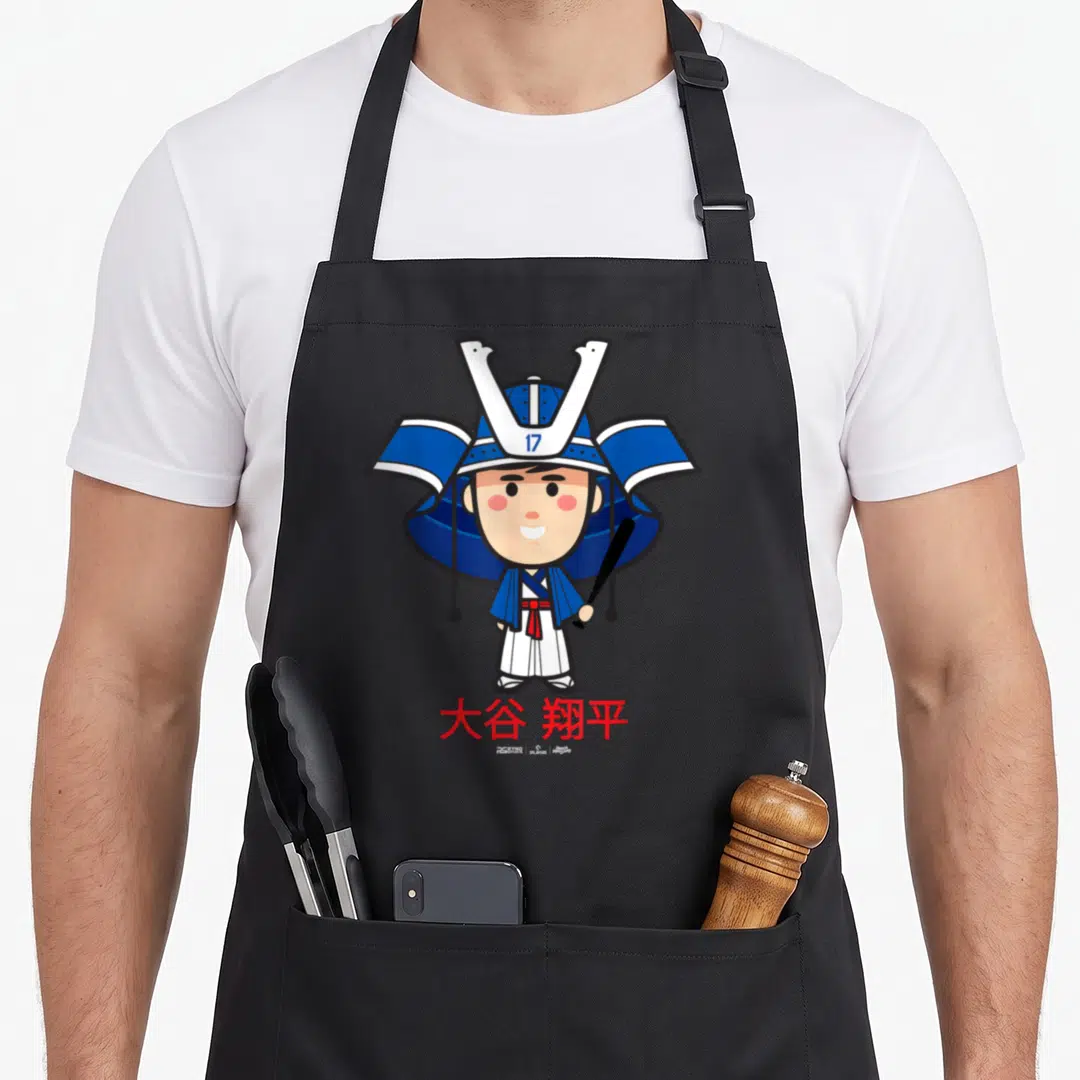 Samurai baseball apron - Chibi samurai holding black bat, red kanji below, 17 on blue helmet — shown on a black cotton canvas apron against a white background