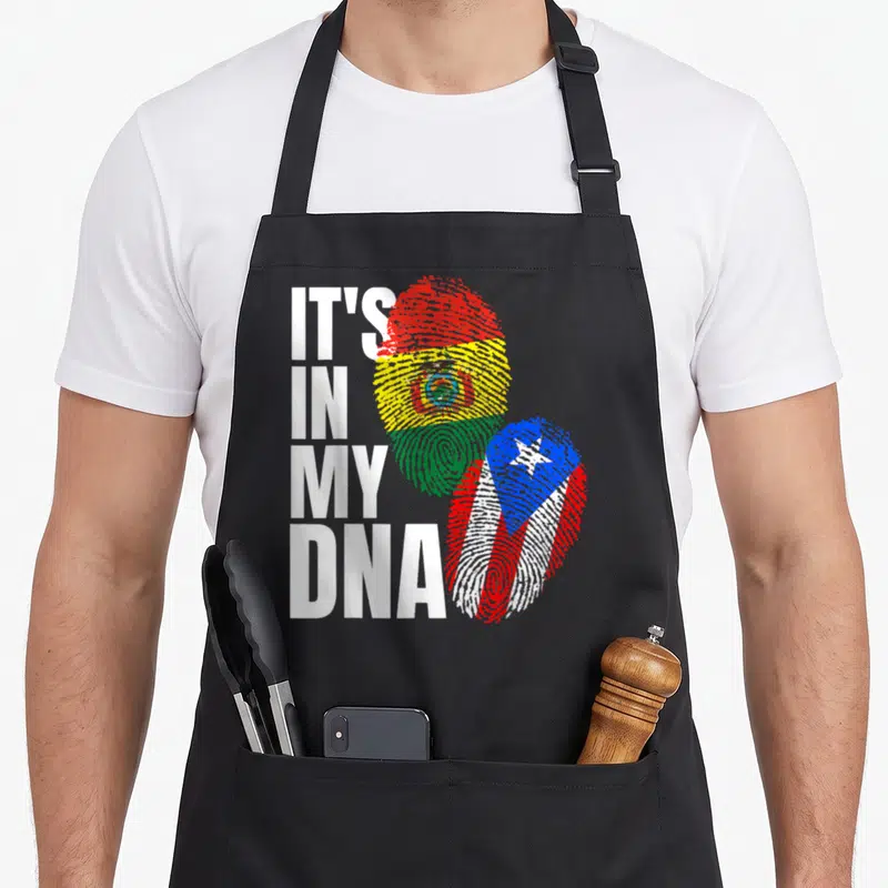 Rican bolivian heritage aprons - IT'S IN MY DNA text beside two fingerprints filled with Bolivian and Puerto Rican flag — shown on a black cotton canvas apron against a white background