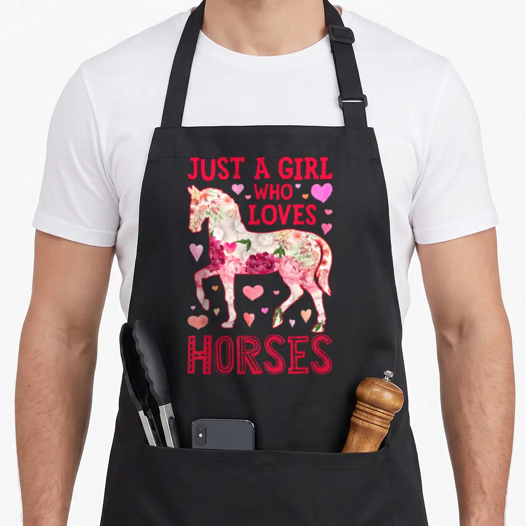 Horse horseback riding farm apron - Floral horse silhouette with Just A Girl Who Loves Horses text and pink hearts — shown on a black cotton canvas apron against a white background