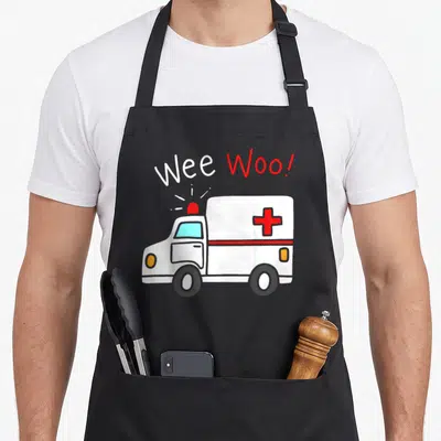 Emt ambulance apron - Wee Woo text above white ambulance with red siren and cross — shown on a black cotton canvas apron against a white background