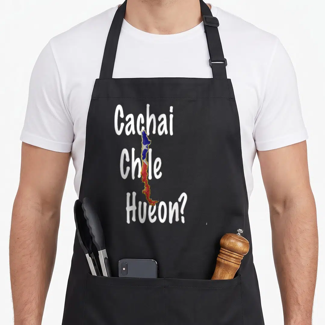 Cachai cachaca apron - Vertical Chile map in flag colors overlapping stacked white text reading Cachai Chile Hueon — shown on a black cotton canvas apron against a white background