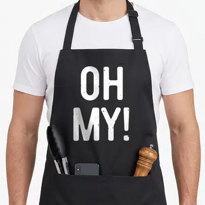 Funny costume apron - Stacked white OH MY! text in bold distressed font — shown on a black cotton canvas apron against a white background