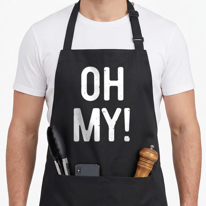 Funny costume apron - Stacked white OH MY! text in bold distressed font — shown on a black cotton canvas apron against a white background