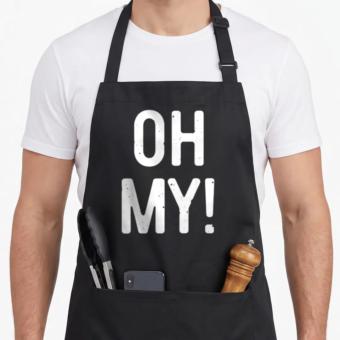 Funny costume apron - Stacked white OH MY! text in bold distressed font — shown on a black cotton canvas apron against a white background