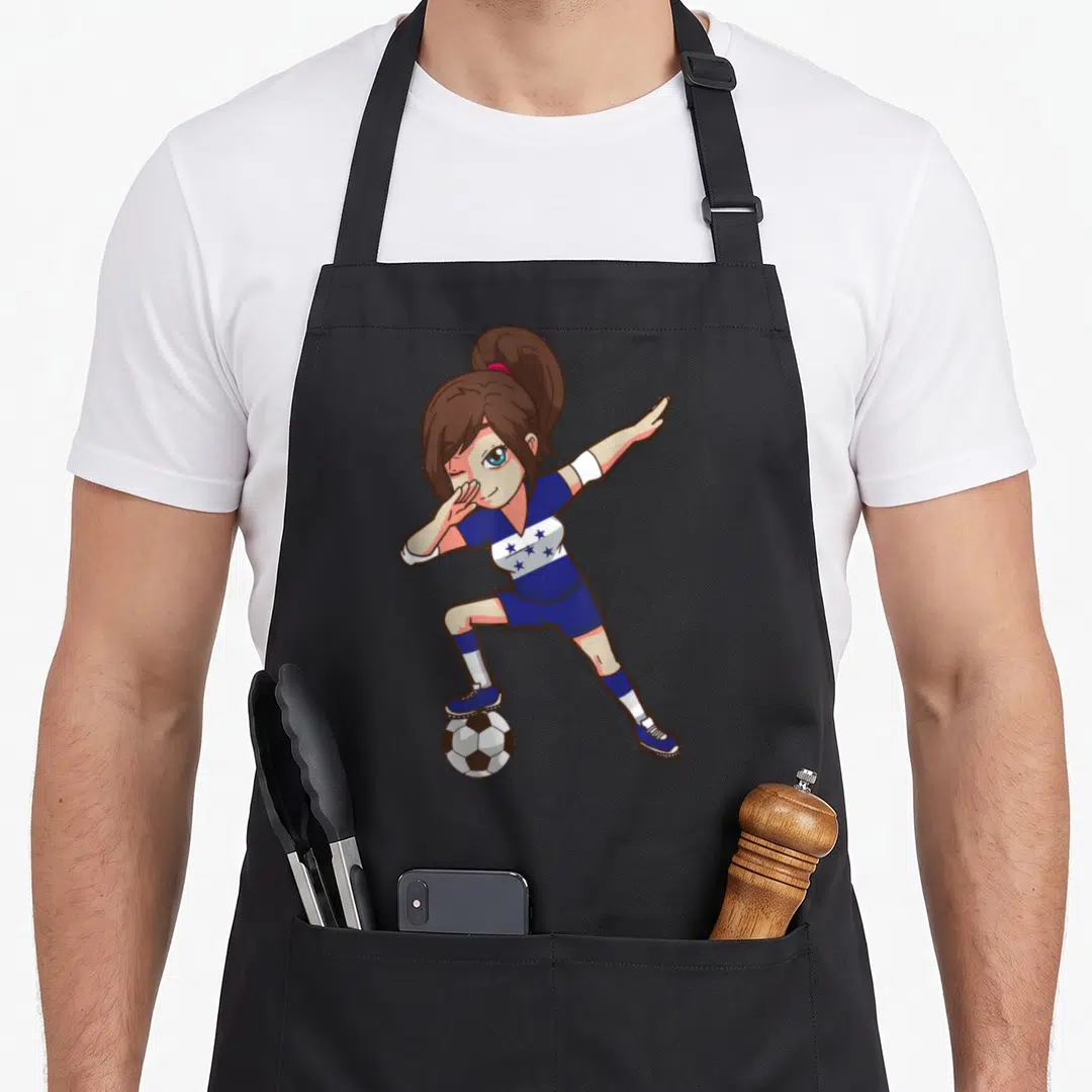 Soccer honduran boy apron - Cartoon girl in blue star-striped kit winking while balancing foot on a soccer ball — shown on a black cotton canvas apron against a white background