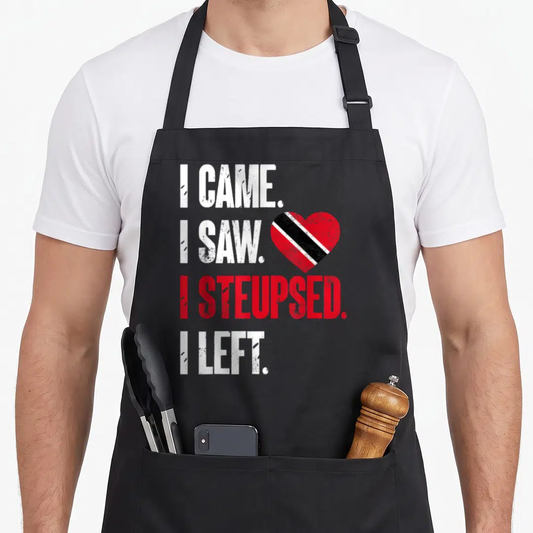 Funny flag trinidad and tobago apron - I CAME I SAW I STEUPSED I LEFT text with red black white heart flag distressed — shown on a black cotton canvas apron against a white background