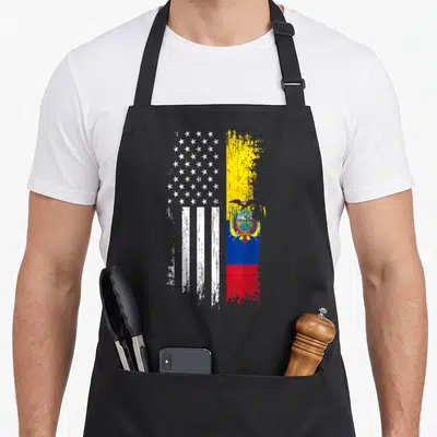 Ecuadorian pride american flag apron - Split vertical flag with white stars stripes and yellow blue red bands — shown on a black cotton canvas apron against a white background