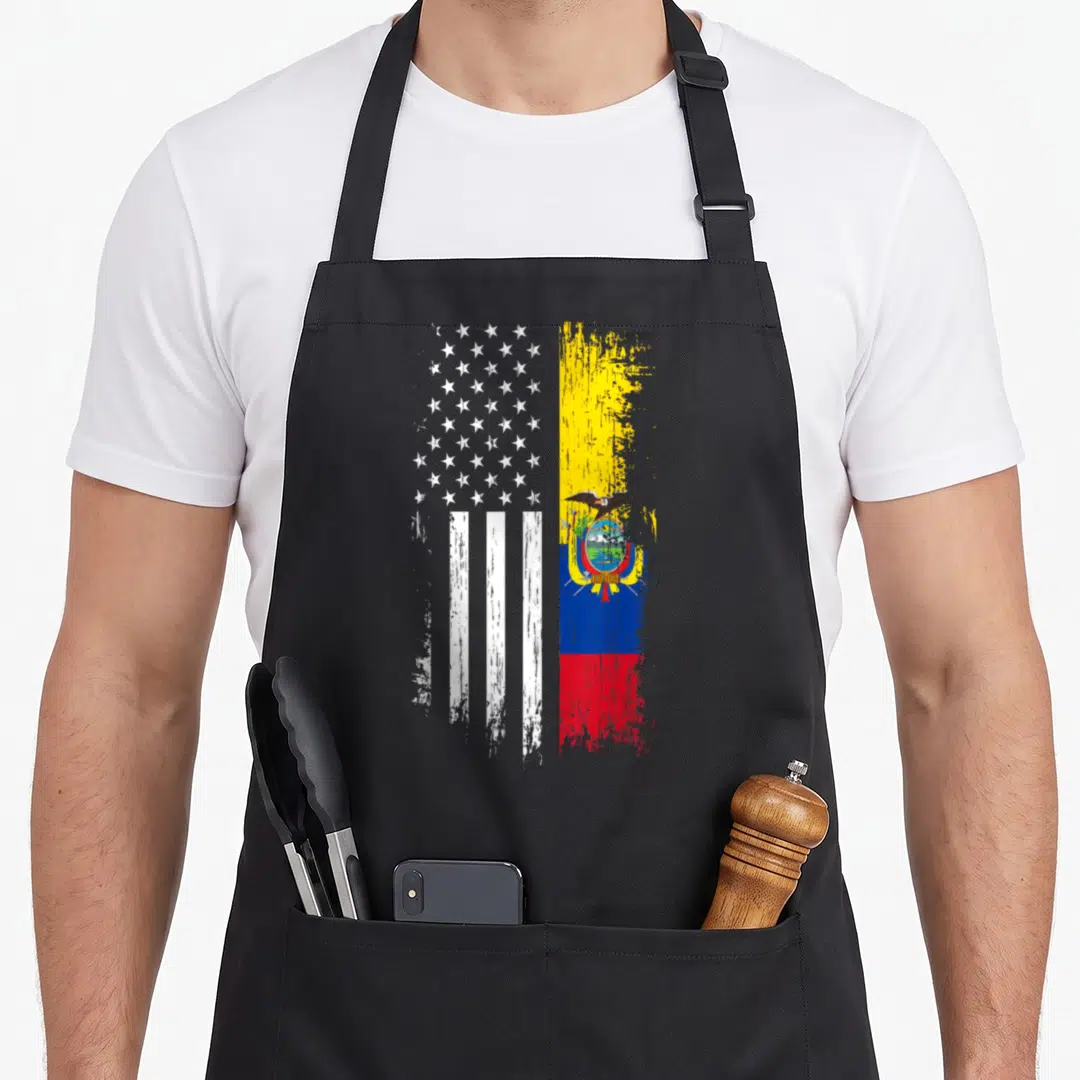 Ecuadorian pride american flag apron - Split vertical flag with white stars stripes and yellow blue red bands — shown on a black cotton canvas apron against a white background