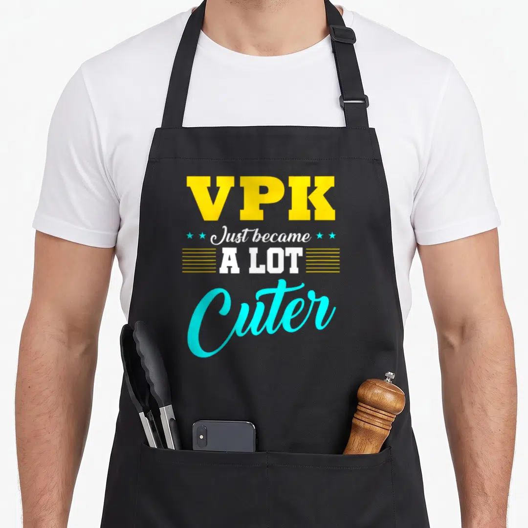 Vpk preschool apron - Yellow VPK text above white Just became A LOT Cuter script with cyan stars and lines — shown on a black cotton canvas apron against a white background