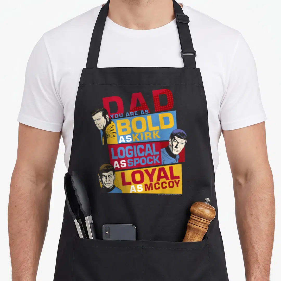 Original thriller apron - Retro Star Trek style graphic with portraits and text praising dad qualities — shown on a black cotton canvas apron against a white background