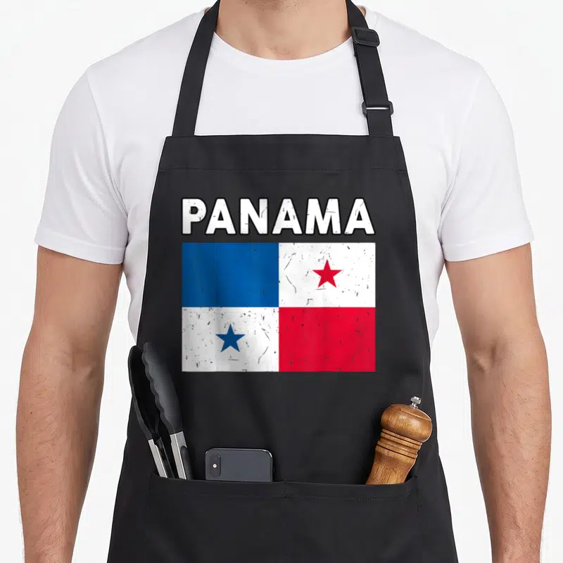 Panama hispanic aprons - Distressed PANAMA text above blue white and red flag with stars — shown on a black cotton canvas apron against a white background