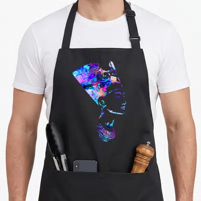Nefertiti egyptian apron - Watercolor profile silhouette of Nefertiti filled with blue, purple, pink, and cyan splashes — shown on a black cotton canvas apron against a white background