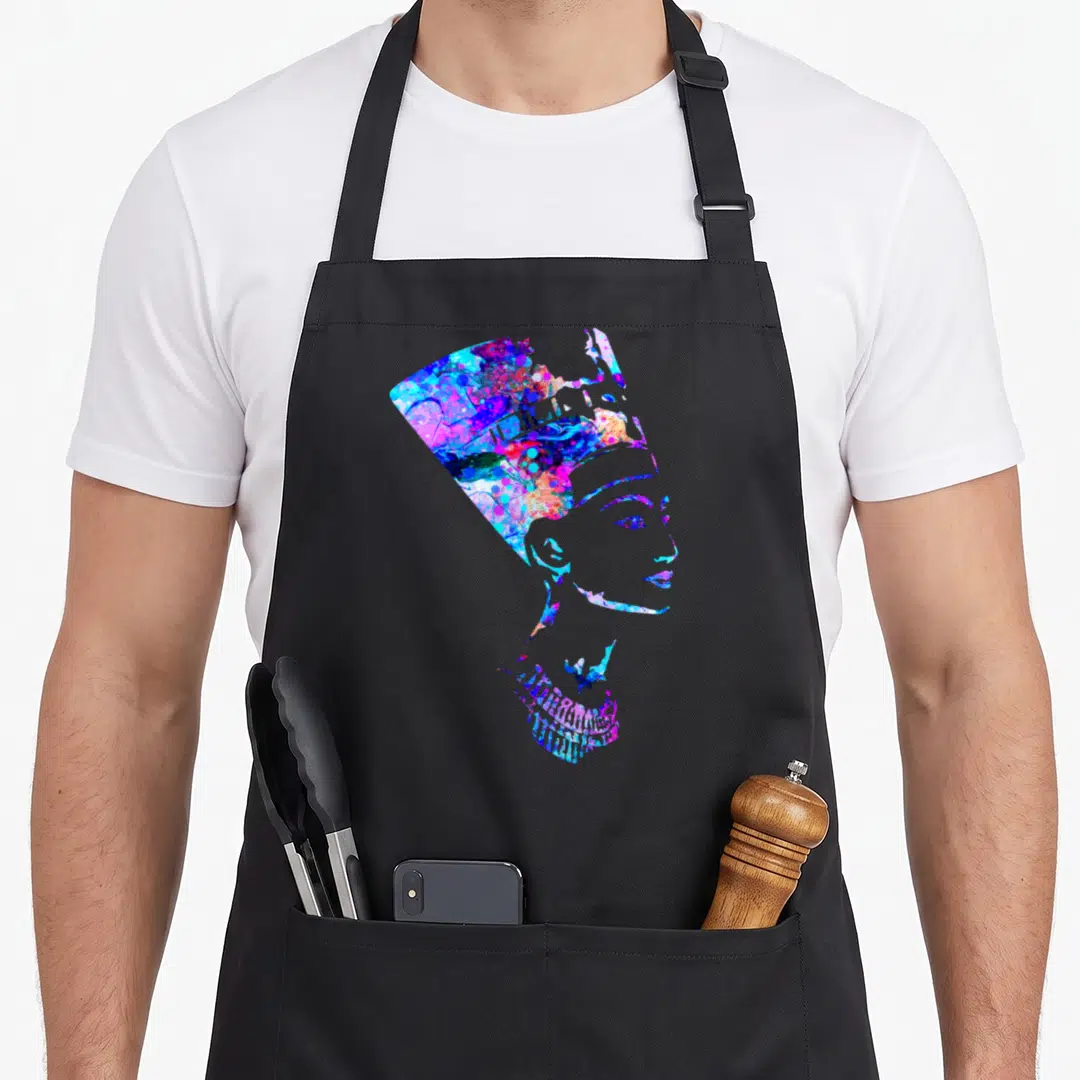 Nefertiti egyptian apron - Watercolor profile silhouette of Nefertiti filled with blue, purple, pink, and cyan splashes — shown on a black cotton canvas apron against a white background
