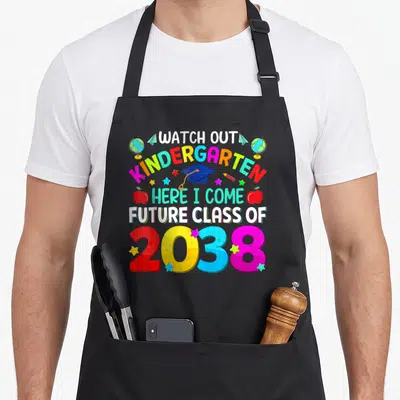 Come future class apron - Watch Out Kindergarten Here I Come Future Class of 2038 text with cap, globes, planes — shown on a black cotton canvas apron against a white background