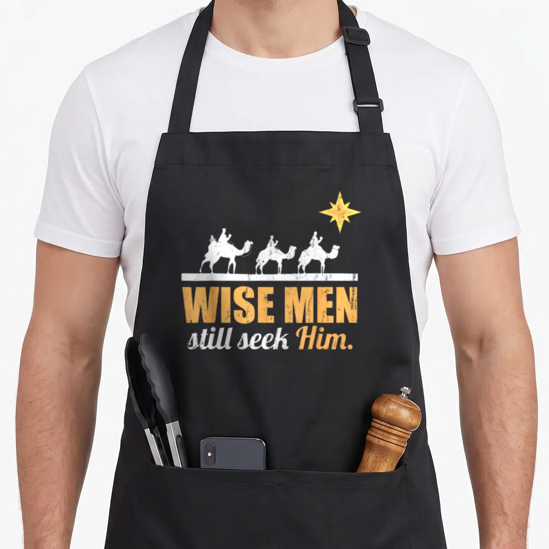Jesus lord christian apron - Three white camels facing right above yellow and white text reading Wise Men still seek Him — shown on a black cotton canvas apron against a white background